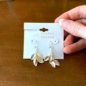 Gold and silver leaves dangle earrings
